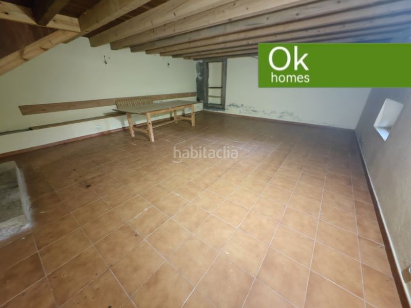 Foto ce25f058-1d5e-460b-a9ff-450f09431f4a. Casa adossada amb xemeneia a Friol