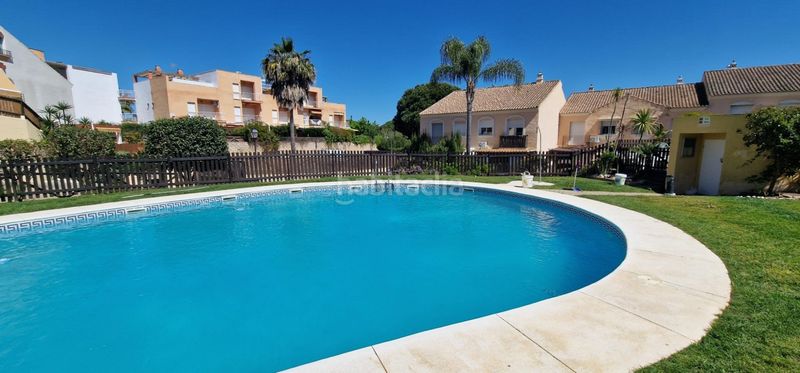 Foto bc2915f9-afc2-401a-a489-175c40e9d5c5. Casa adossada amb aparcament piscina a Islantilla golf Islantilla