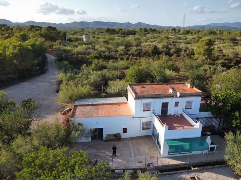 Foto c4d3cf39-c183-41a6-8811-9770213aa465. Masía magnífica finca rústica de 14.000 m2 con casa legalizada, luz de red y pozo propio a 5 km del mar en Perelló (El)