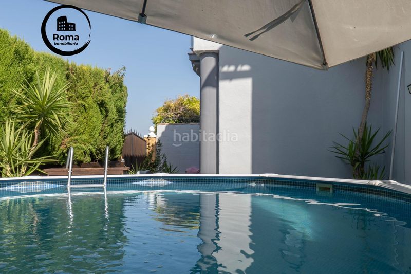 Foto b86d23da-a363-42c1-ab06-a700051944a9. Casa aparellada amb calefacció aparcament piscina a Zubia (La)