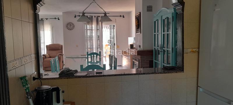 Foto 5c7d1d09-d547-4ed6-925a-455ad09b71c3. Semi detached house with fireplace parking pool in Manilva