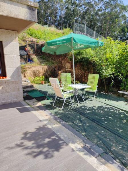 Foto 7389d452-b397-416f-82ba-434c3f49bab2. Chalet avec parking dans Bueu