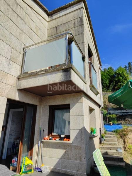 Foto fbc68865-e3b6-4c5c-b54e-7fd18867b079. Chalet avec parking dans Bueu