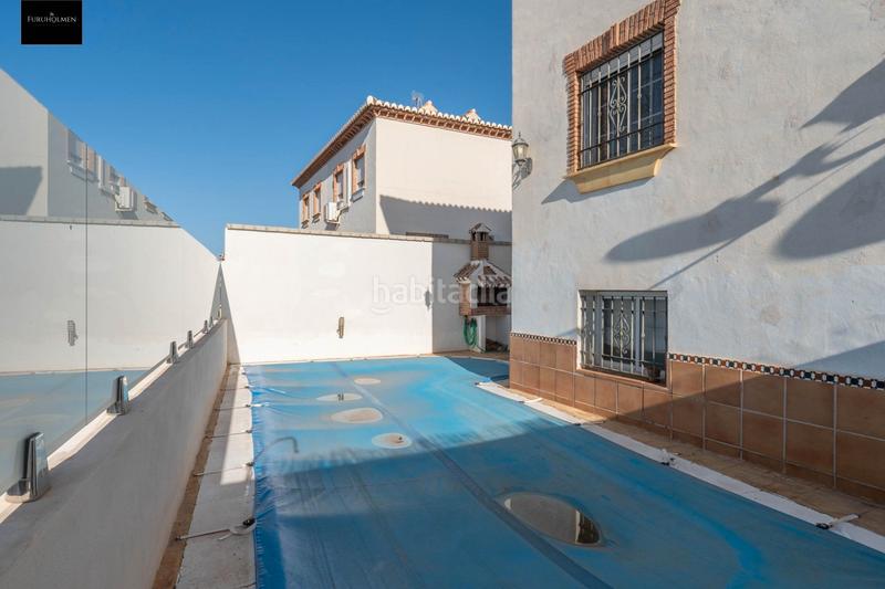 Foto d765272d-acae-48fb-8ad2-44f9d7914a8a. Casa pareada  con piscina en Otura