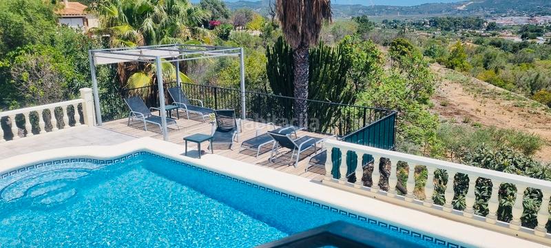 Foto af47d2d6-b55f-4e08-acb7-2a5cde81a428. Chalet avec cheminée chauffage parking piscine dans Xaló