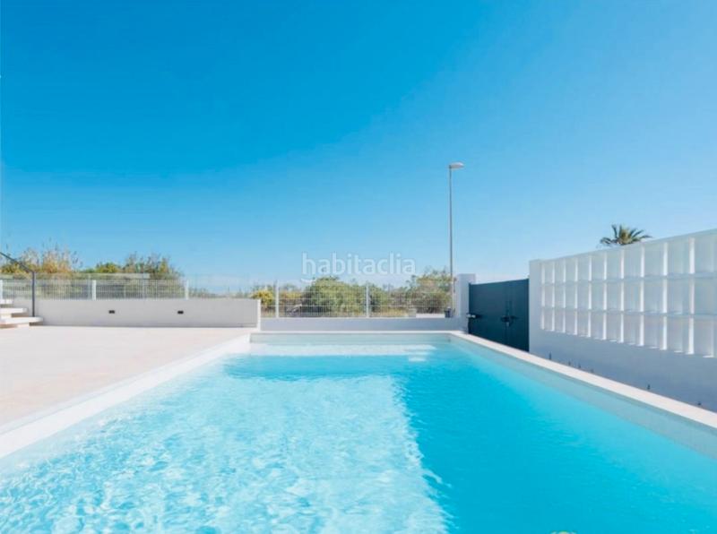 Foto c3cbf076-e457-4466-b4e1-bc6ed4401911. Chalet with fireplace parking pool in Oliva playa Oliva