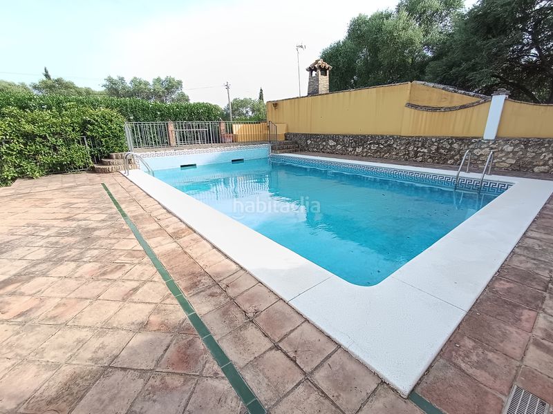 Foto 66554e4f-f5ce-42bf-8023-c6da86b5fa6b. Xalet amb xemeneia calefacció aparcament piscina a Palma del Río
