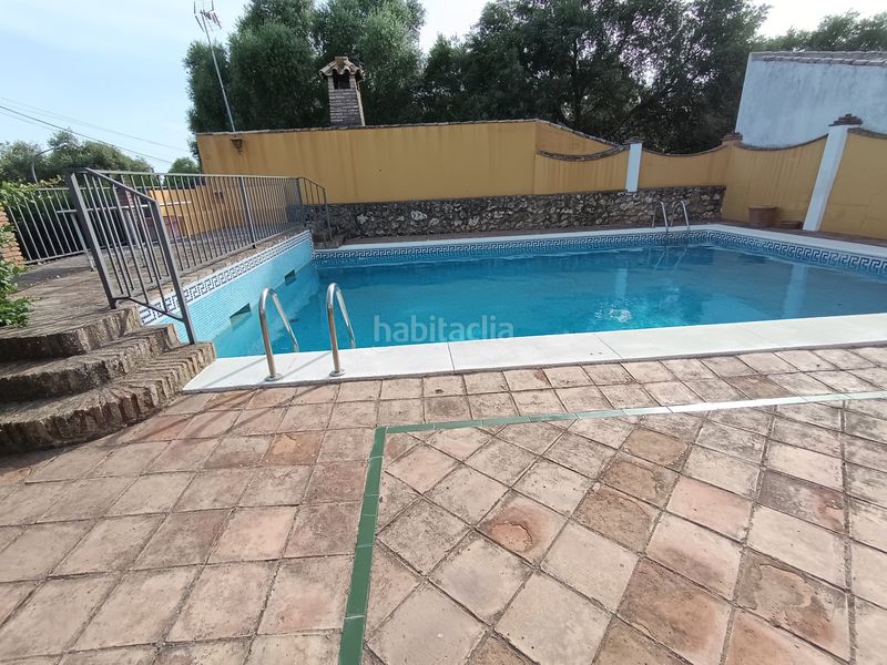 Foto b00bac9b-8058-486d-8a61-ae8d978c8c3c. Xalet amb xemeneia calefacció aparcament piscina a Palma del Río
