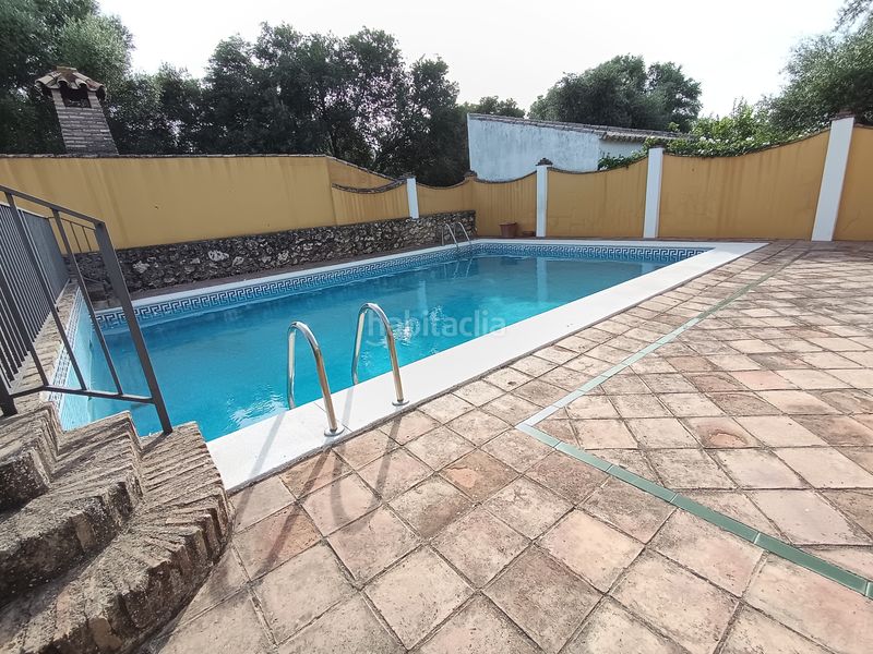 Foto b1ab5fac-a191-4a6f-b826-9d1230a67857. Xalet amb xemeneia calefacció aparcament piscina a Palma del Río