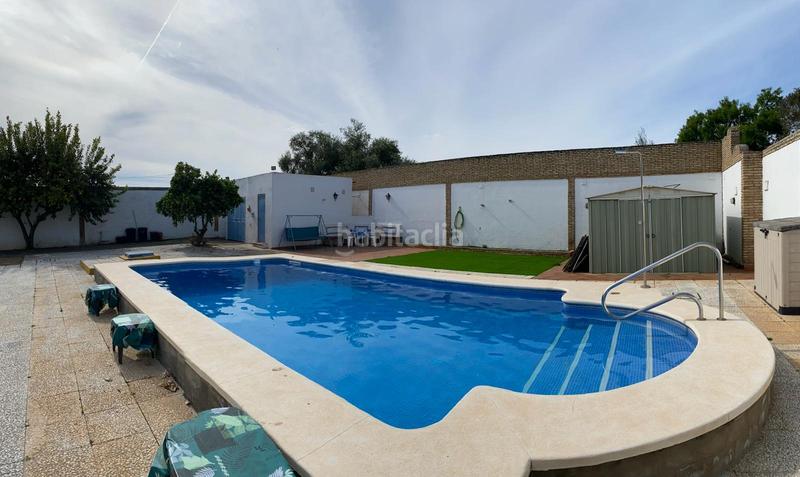 Foto b89dd27a-b156-4947-a891-19ccd38c9c5a. Xalet amb xemeneia piscina a Oromana Alcalá de Guadaira