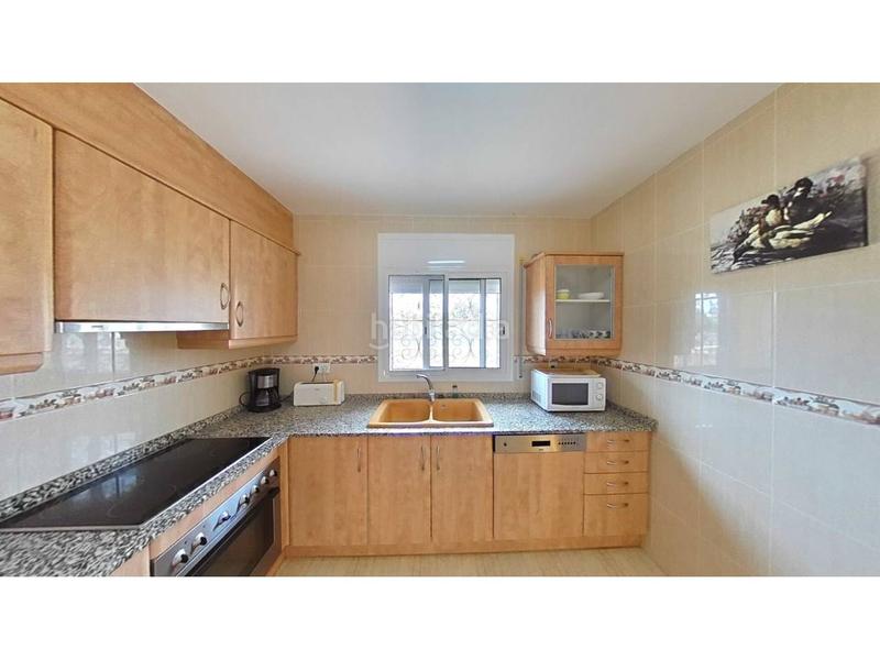 Foto b9816422-53f1-4799-99d7-39dfc576306a. Reihenhaus mit parking pool in Passeig Marítim Miami Platja