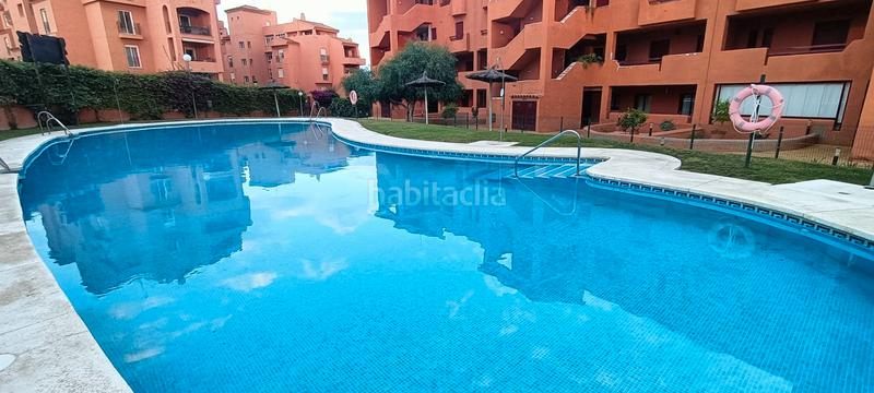 Foto f61f174b-f08b-4c05-8cbc-bb7aee08445c. Piso encantador bajo de 2 dormitorios con jardín privado en la duquesa en Manilva
