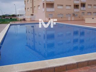 Appartement à Passeig Marítim. Apartamento en planta baja con terraza y piscina comunitaria