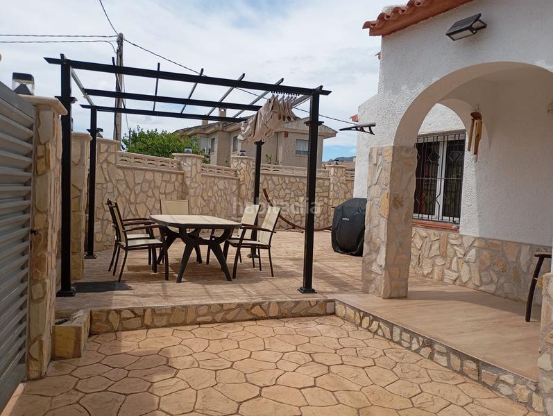 Foto c24fede9-2e15-486d-8b39-c8cca6e8f2bb. Casa amb aparcament a Centre Miami Platja