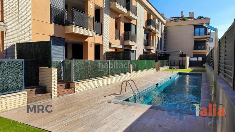 Foto 48c43ba2-b021-4907-ad53-896fc762704e. Piso apartamento con piscina y parking en el centro. en Palamós