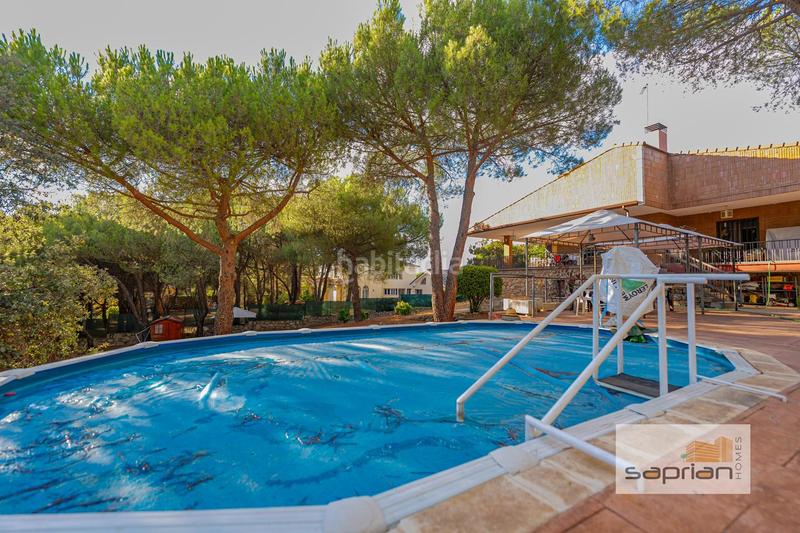 Foto b57bf188-8e8c-4fc1-9217-672aed28d644. Casa amb piscina a Parquelagos-Puente Nuevo Galapagar