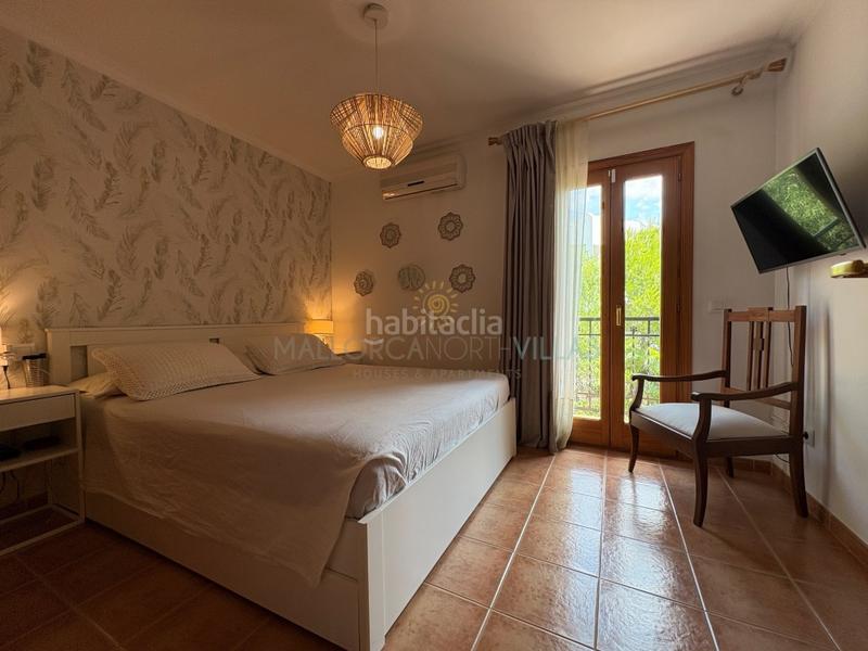 Foto 0b6d9809-c6d0-4b0f-8572-497d0d3b2a50. Casa adossada amb aparcament a port de Pollença Pollença