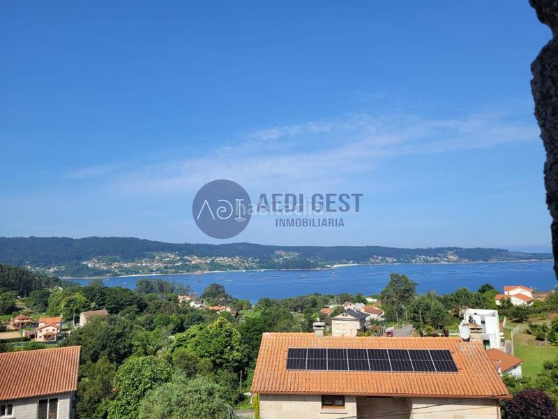 Foto 51cc41a6-5e35-43ab-a693-5f748e704dba. Casa con riscaldamento parcheggio in Aldán Cangas