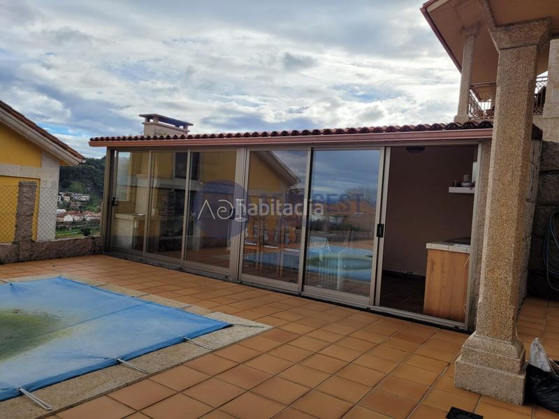 Foto cf7d3b78-1754-49a4-9e11-414e3e308f18. Chalet avec chauffage parking piscine dans Baiona