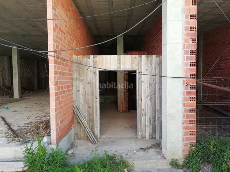 Foto b4af5d3d-1d56-495a-8e24-c499d6bd6c4f. Edificio  en construcción en el centro en Laxe