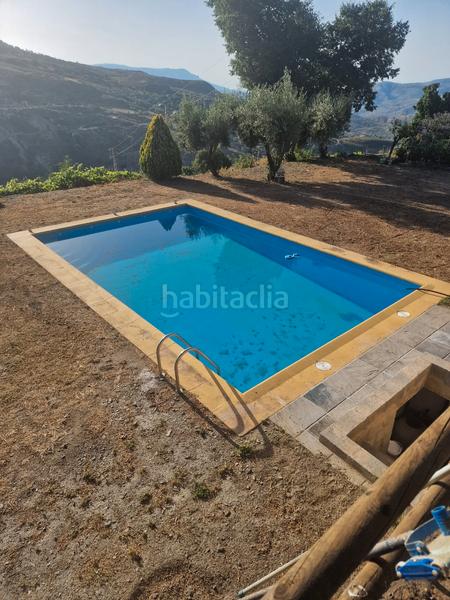 Foto 3ddfee14-9fbb-4dc9-aefb-a6655c9740e1. Xalet amb xemeneia calefacció aparcament piscina a Bérchules