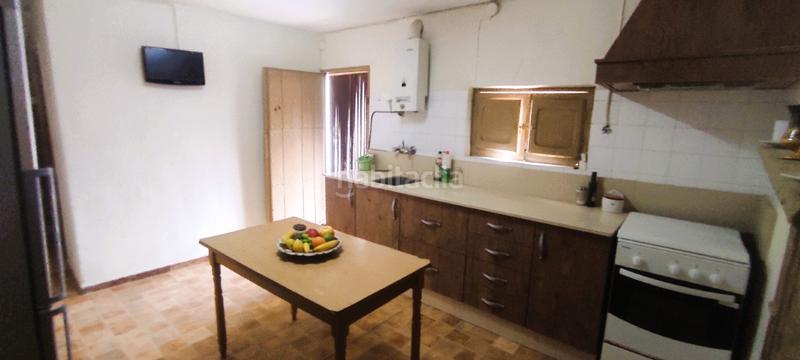 Foto d1b3f5f2-7bb8-4cd0-b84a-99d1ade3977e. Haus mit kamin in Berja