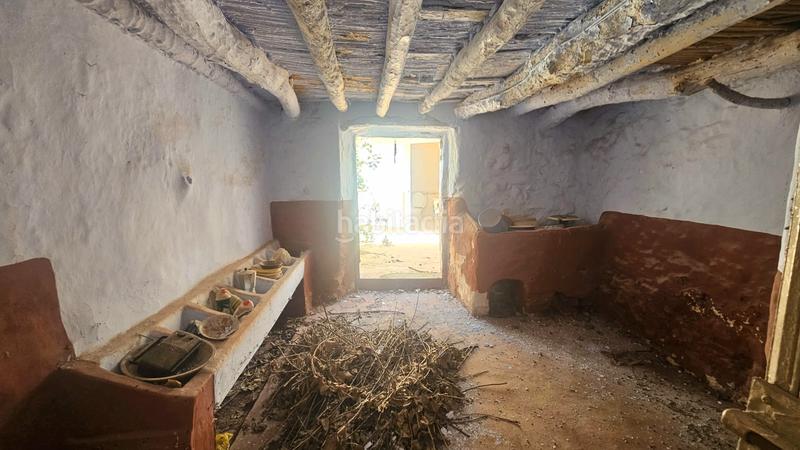 Foto f2cba703-34d5-465a-bcd5-253a96a1c5df. Semi detached house with fireplace in Alfarnate