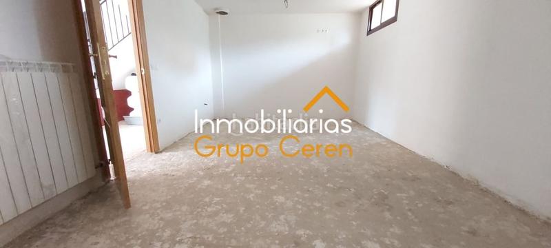 Foto 1b095529-075c-44ae-88c8-98a1c468df70. Casa adosada adosado a estrenar con jardín privado en urbanización con piscina y amplia zona verde en Canillas de Río Tuerto