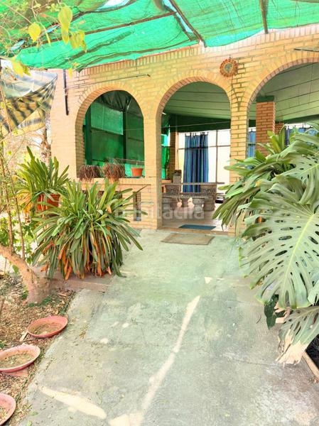 Foto 48a2f354-0feb-41ed-89c7-337fd27c0303. Casa chalet con doble vivienda, buhardilla, gran parcela y piscina en urbanización torrepalma en Carmona