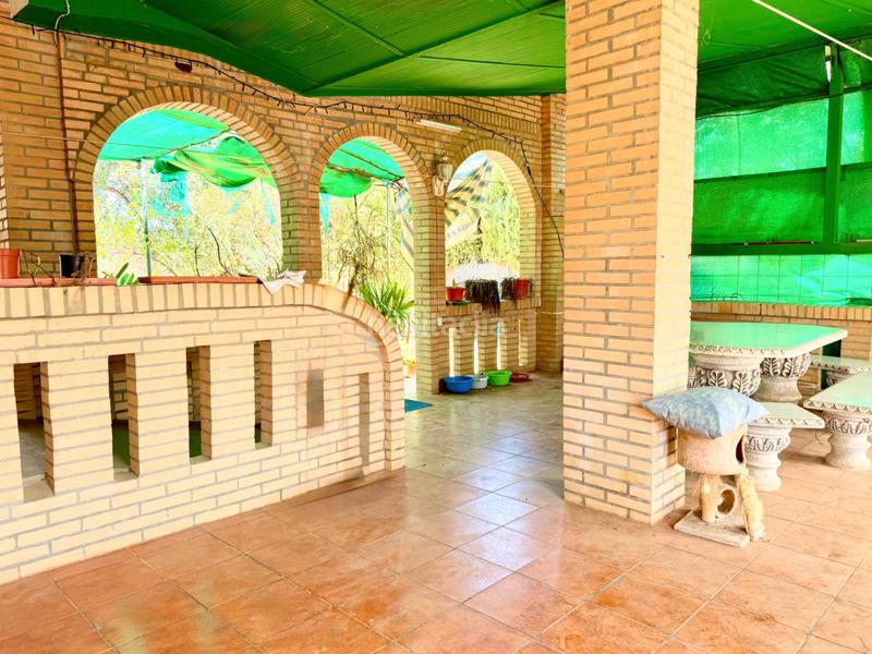 Foto 61f1488d-0888-4a12-a34c-2b3444897f80. Casa chalet con doble vivienda, buhardilla, gran parcela y piscina en urbanización torrepalma en Carmona