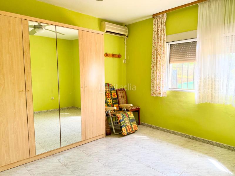Foto d11e7c24-273a-44e9-933d-d00501620ef0. Casa chalet con doble vivienda, buhardilla, gran parcela y piscina en urbanización torrepalma en Carmona