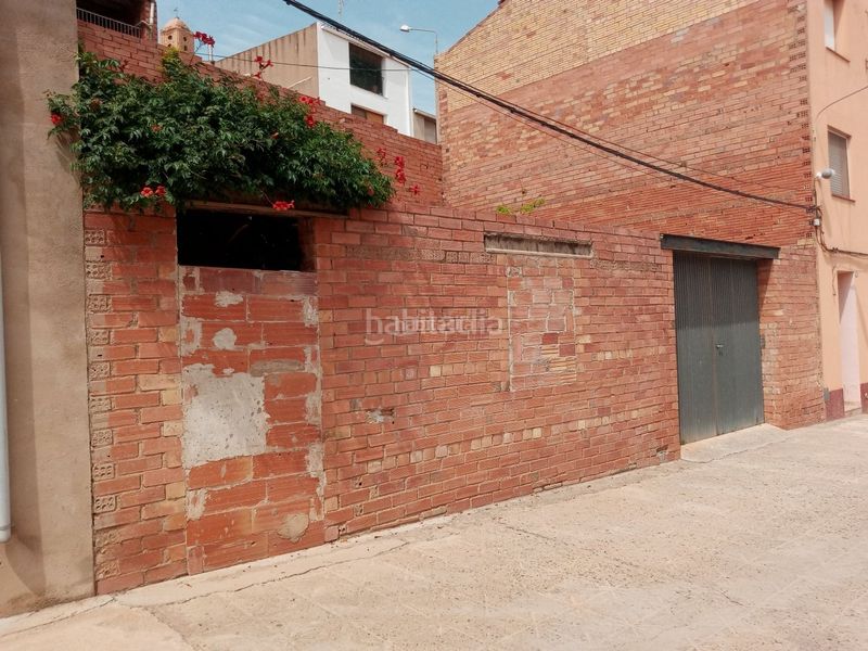 Foto 539d2b06-4f32-41e4-b8a6-7d78d5d47b1b. Planta baja en carrer de l'església 22 parcela urbana. centro poblacion en Corbera d´Ebre