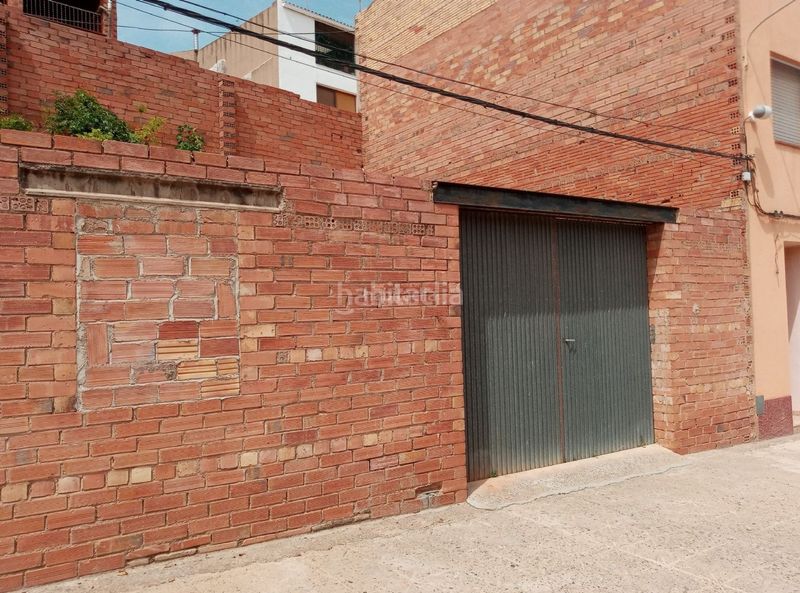 Foto 65200a3b-d076-4250-ab00-9c5bdc8caed2. Planta baja en carrer de l'església 22 parcela urbana. centro poblacion en Corbera d´Ebre
