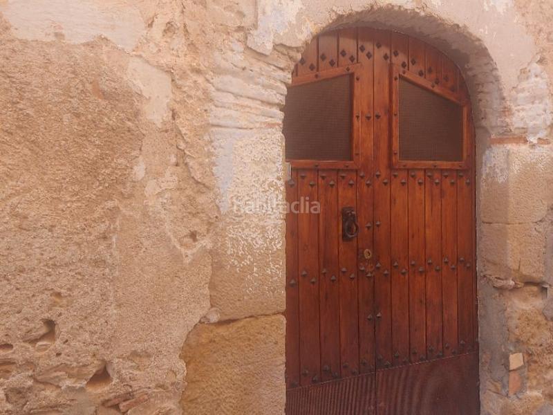 Foto 3d35a75d-bfbc-4fdc-8902-caa6da988293. Casa pareada en l'escultor 10 casa aparejada, antigua, habitable, con huerta, en un entorno envidiable en Granadella (La)