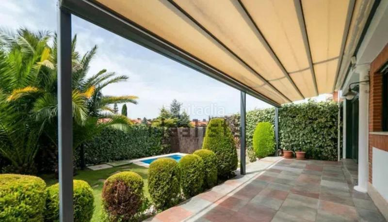 Foto d1029d57-4732-46e0-9c5e-018fdb46094d. Affitto chalet con camino riscaldamento parcheggio piscina in La Moraleja