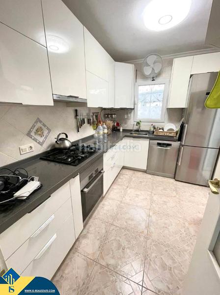 Foto 005629c4-287b-4716-aed5-63e25cb60a5c. Casa aparellada amb piscina a Playa Flamenca Orihuela