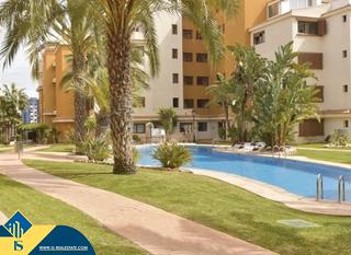 Piso en Punta Prima. Apartamento con piscina compartida en la provincia de alicante,