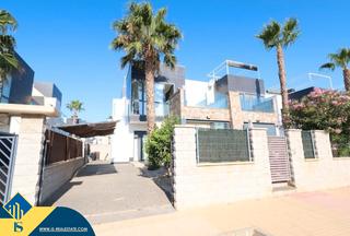Maison jumelée à Lomas de Cabo Roig - Los Dolses. Casa con piscina comunitaria, en la provincia de alicante, en la