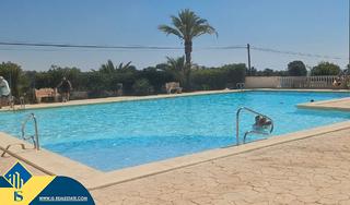 Piso en Punta Prima. Apartamento con piscina comunitaria, en la provincia de alicante