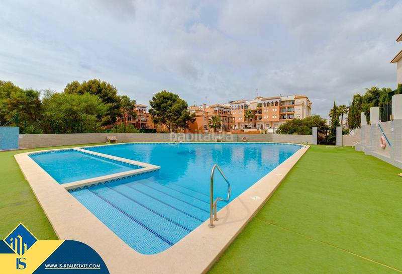 Foto 7a9a7c71-6b3d-4b5f-a8f0-ce64a4d4a34b. Dúplex amb calefacció piscina a Playa Flamenca Orihuela