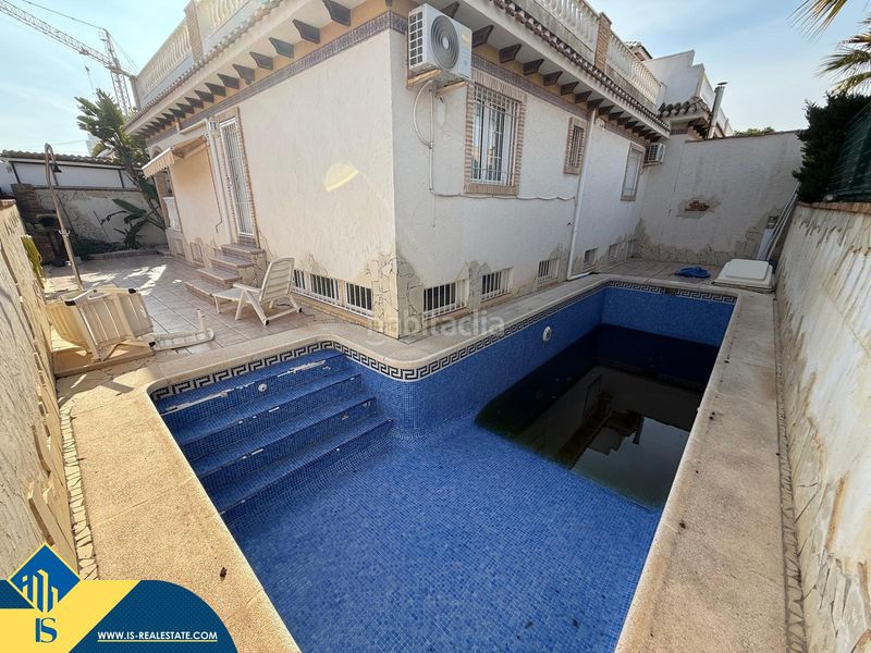 Foto 9a3feb98-f639-46c7-8f38-6fb426105d82. Casa amb aparcament piscina a Campoamor Orihuela