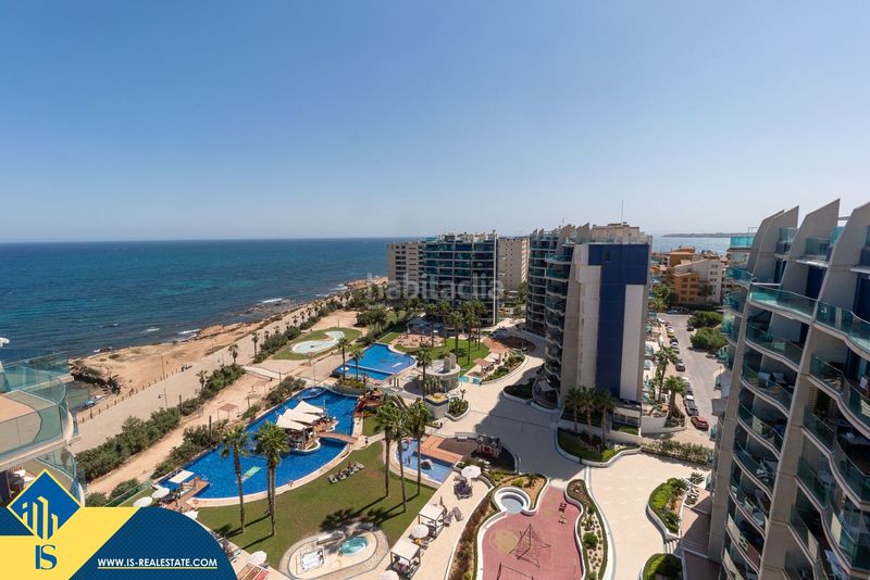 Foto 5d66bf4a-ae6d-4ffe-bb25-664d7c72e8bc. Àtic amb aparcament piscina a Punta Prima Torrevieja