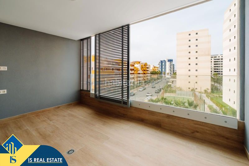 Foto 3898c7d9-7e54-445e-895e-0b3321ad639a. Apartment with heating pool in Punta Prima Orihuela