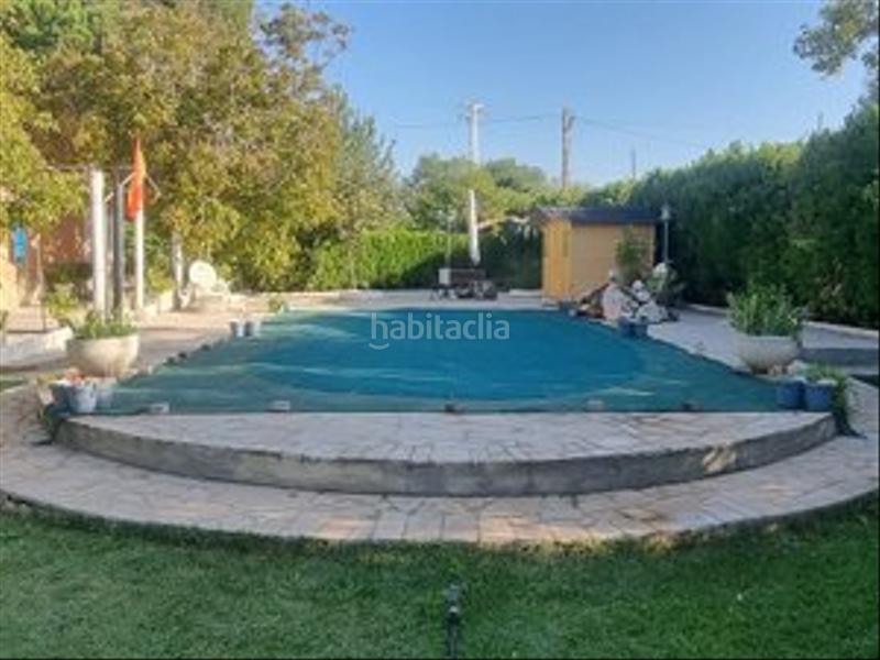 Foto d7a36fe8-9806-4070-ad42-5318b382a7e1. Masia amb xemeneia calefacció piscina a Colmenar de Oreja