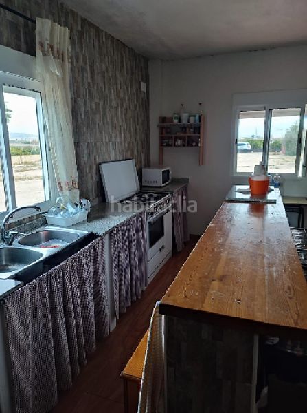 Foto e63e9e9d-0e8e-4da6-b2ef-0145569610ef. Casa aparellada a Daya Nueva