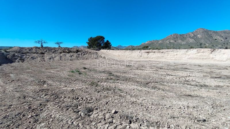 Foto 1a8cd7fe-d3c6-47a1-b091-fde40f5d71fd. Finca rústica parcela urbanizable de 7.984 m con agua potable en Abanilla
