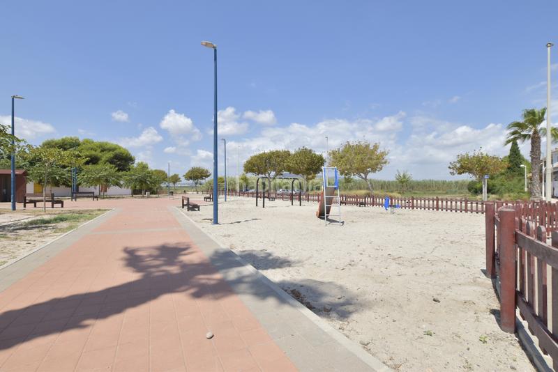 Foto b923f32d-33aa-46b4-a0dc-b78e756c34bb. Casa adossada amb aparcament piscina a playas de Puçol Puçol