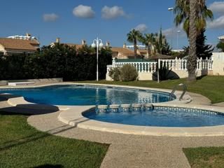 Casa adossada a De panticosa. Amplio dúplex en orihuela costa con jardín y piscina comunitaria