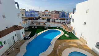 Appartement à San Juan de los Terreros. Apartamento de 1 dormitorio con terraza y piscina en urbanizació