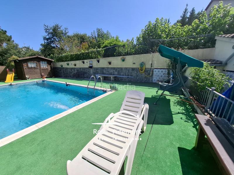 Foto 1659ae5b-abfa-4d55-852e-5527443ab4d0. Casa con camino parcheggio piscina in Aiguaviva Parc Vidreres